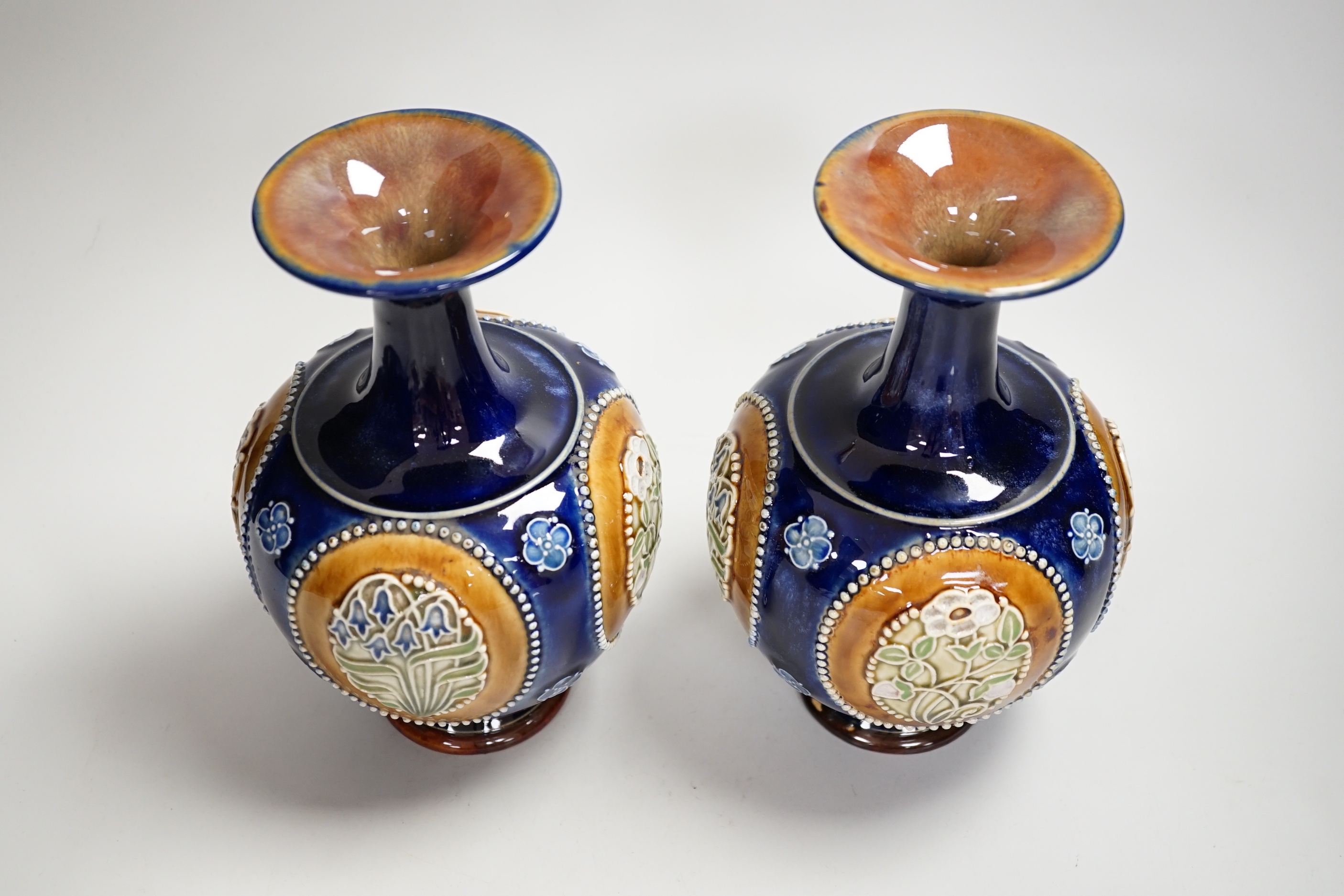 A pair of Royal Doulton vases, 22cm high